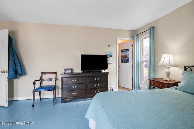 bedroom featuring baseboards