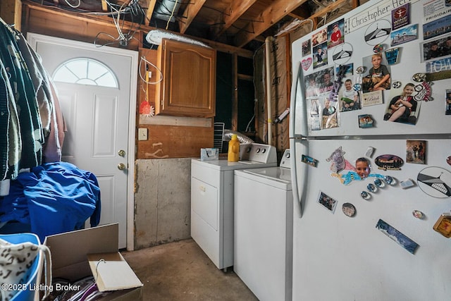 clothes washing area featuring laundry area and separate washer and dryer