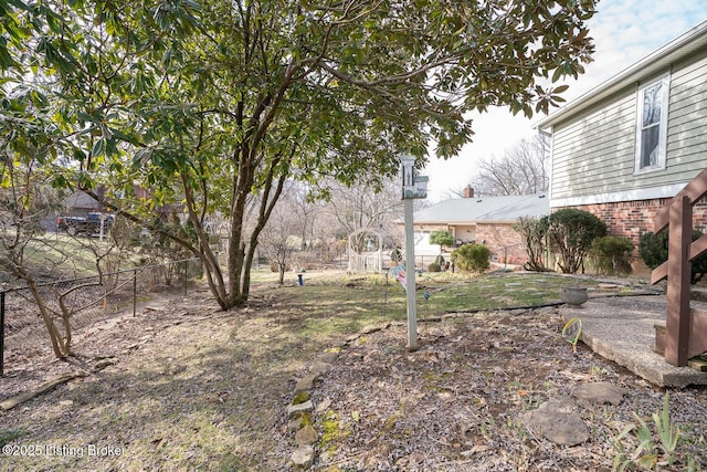 view of yard featuring fence