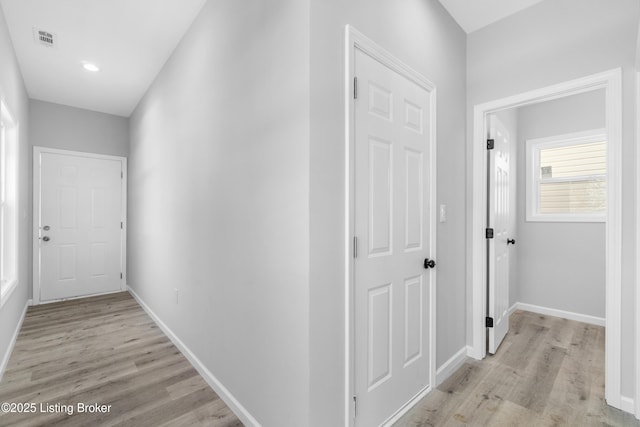 hallway with light wood-type flooring