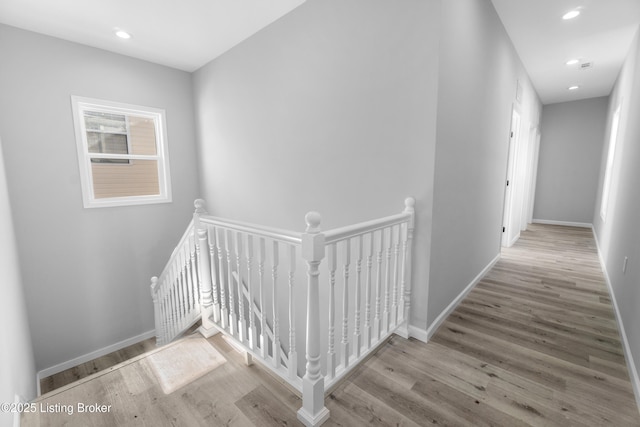 hallway with light wood-type flooring