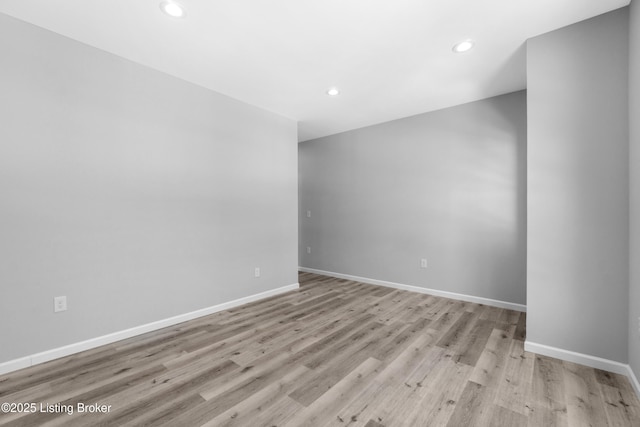 unfurnished room with light hardwood / wood-style flooring