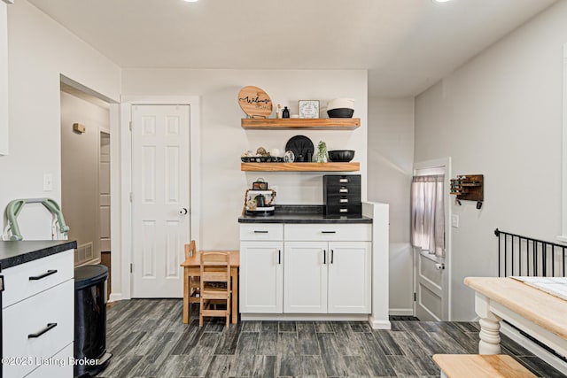 9914 Mccrea Ln, Louisville, KY 40229 - kitchen featuring dark wood finished floors, dark countertops, white cabinets, open shelves, and recessed lighting
