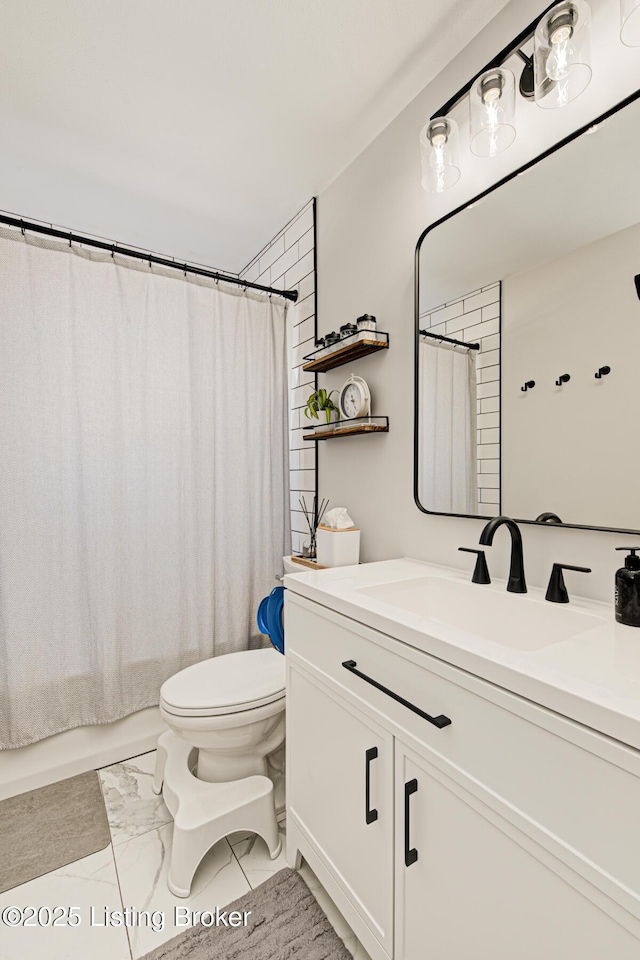 9914 Mccrea Ln, Louisville, KY 40229 - bathroom featuring marble look tile flooring, toilet, vanity, and shower / tub combo with curtain