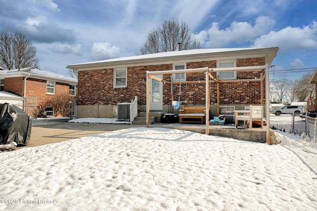 9914 Mccrea Ln, Louisville, KY 40229 - snow covered house featuring brick siding and cooling unit