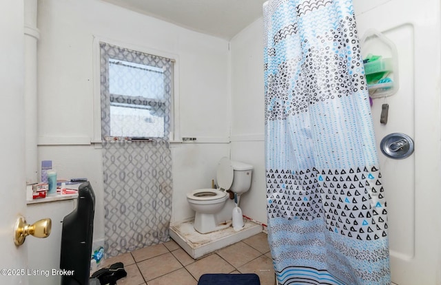 bathroom featuring tile patterned floors and toilet