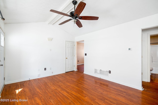 empty room featuring vaulted ceiling with beams, ceiling fan, and wood-type flooring