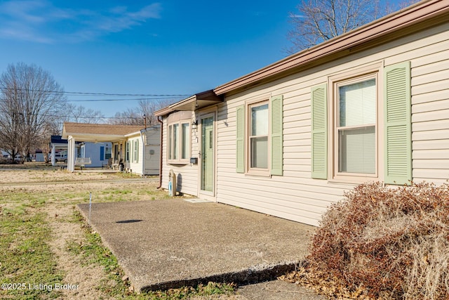 view of property exterior featuring a patio