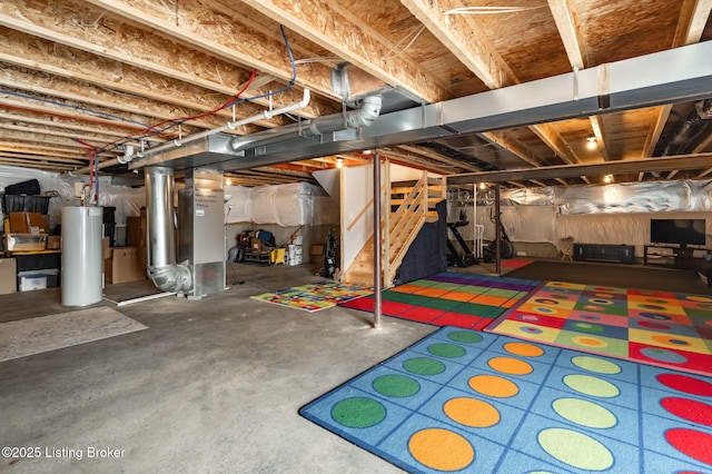unfinished below grade area with heating unit, gas water heater, and stairway