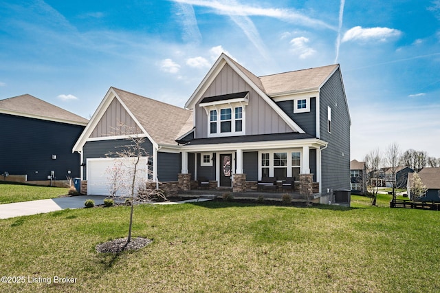craftsman-style house featuring central AC, a garage, board and batten siding, concrete driveway, and a front lawn