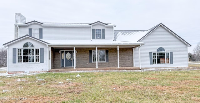 view of front facade with covered porch and a front yard