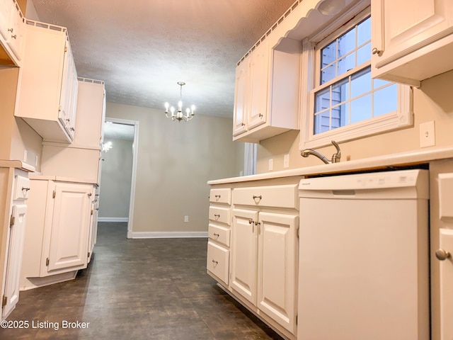 kitchen with a chandelier, sink, a textured ceiling, white dishwasher, and hanging light fixtures