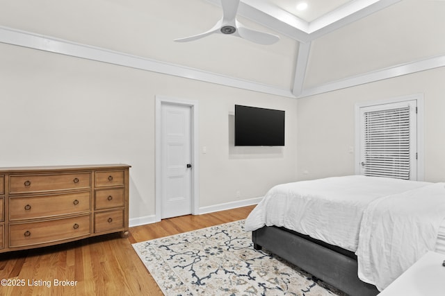 bedroom with light wood-style floors, ceiling fan, baseboards, and vaulted ceiling