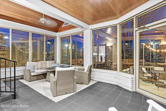 sunroom with wood ceiling and vaulted ceiling