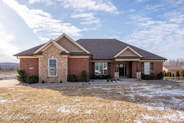 craftsman-style home with a front yard