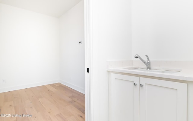 bathroom with hardwood / wood-style flooring and vanity