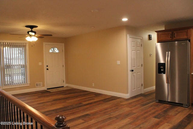 foyer entrance with ceiling fan and dark hardwood / wood-style floors