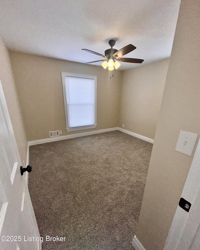 unfurnished room featuring carpet, a textured ceiling, and ceiling fan