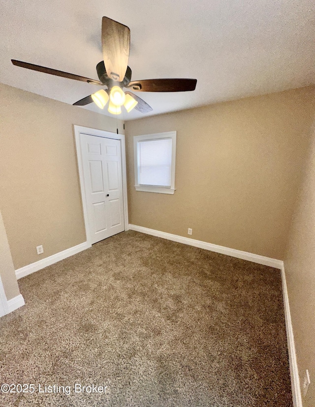 unfurnished bedroom with a closet, ceiling fan, and carpet floors