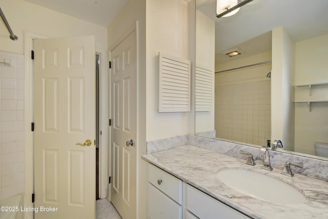 full bath featuring toilet, a closet, and vanity