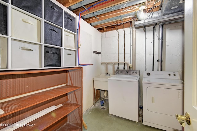 clothes washing area featuring laundry area and washing machine and clothes dryer