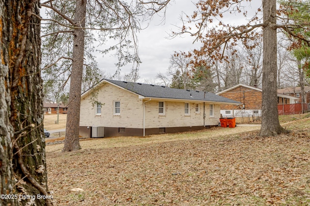 rear view of property with central air condition unit