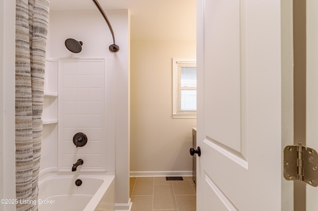 bathroom featuring tile patterned flooring and shower / tub combination
