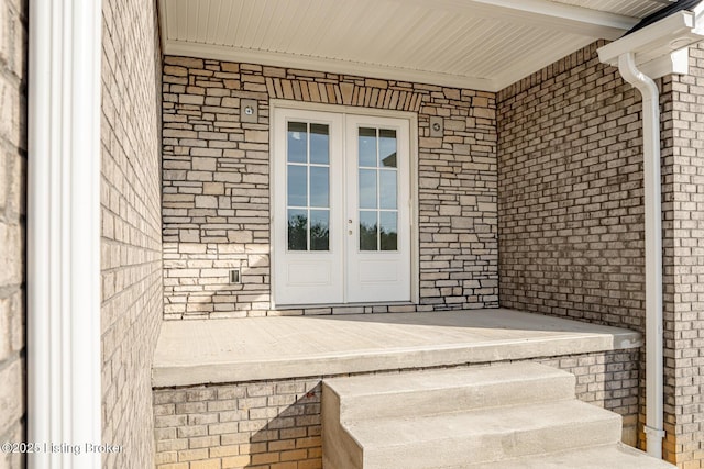 view of exterior entry featuring french doors