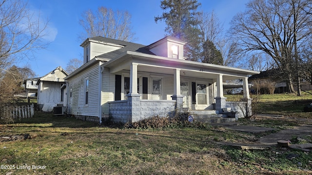 view of front of home featuring cooling unit, a front yard, and a porch