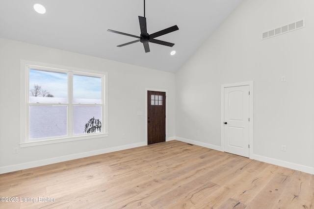 foyer entrance with visible vents, plenty of natural light, and light wood-style flooring