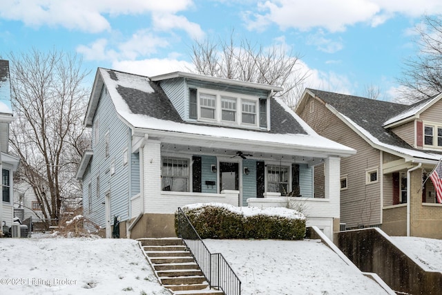 view of front facade featuring central AC unit and a porch