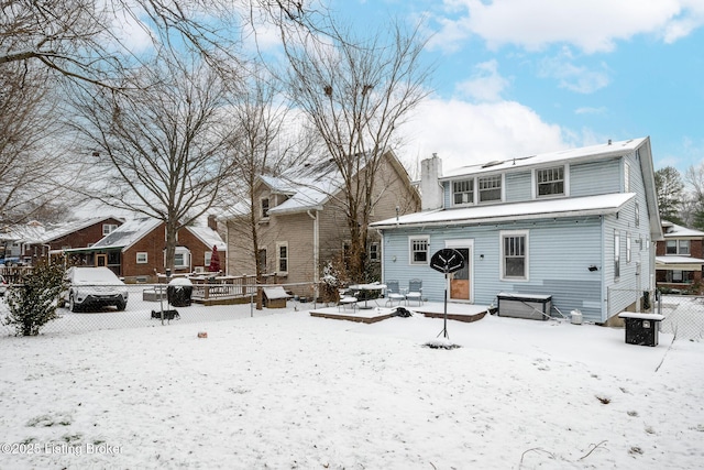 view of snow covered house