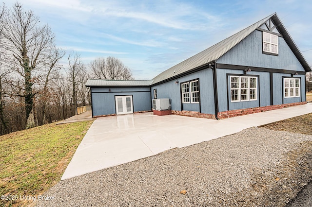 view of front of property with french doors and a patio