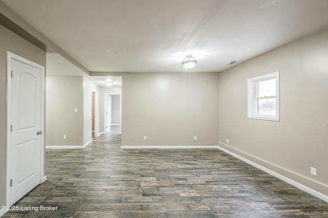 unfurnished room featuring dark wood-type flooring