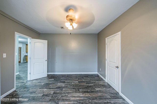 empty room with dark hardwood / wood-style floors