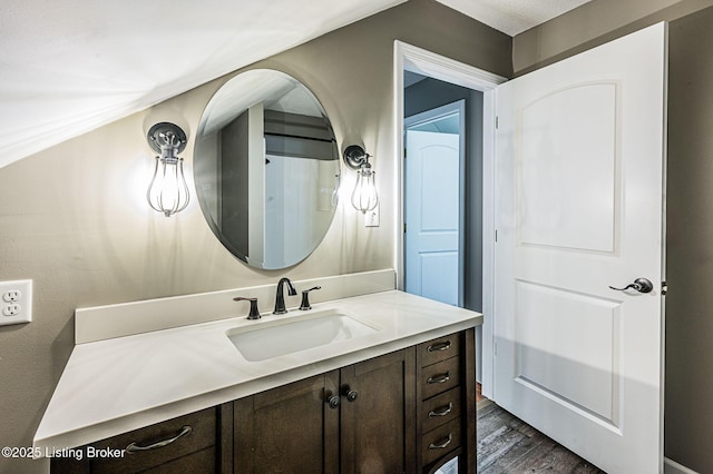 bathroom with hardwood / wood-style floors and vanity