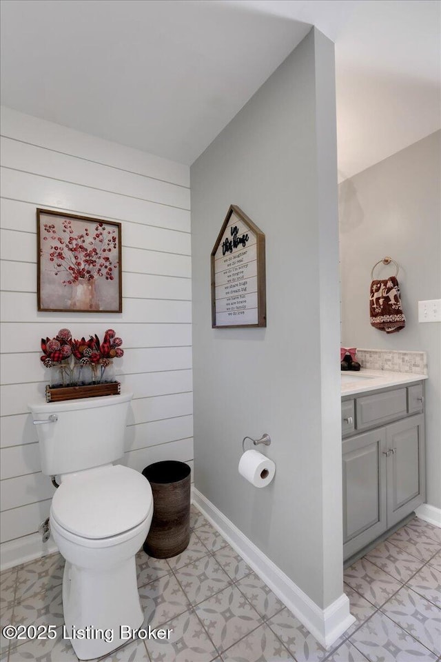 bathroom featuring toilet and vanity