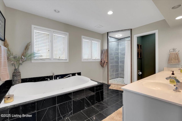 bathroom featuring separate shower and tub, vanity, and tile patterned flooring