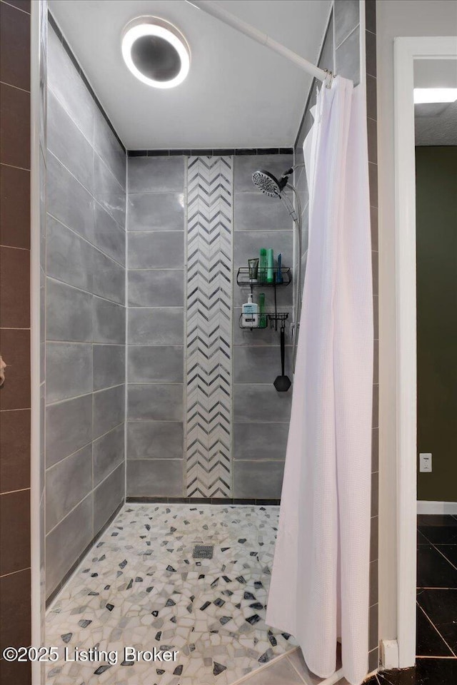 bathroom with a shower with curtain