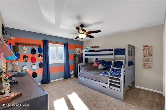 bedroom with ceiling fan and light carpet