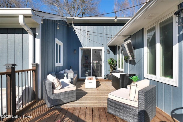 wooden terrace featuring an outdoor hangout area