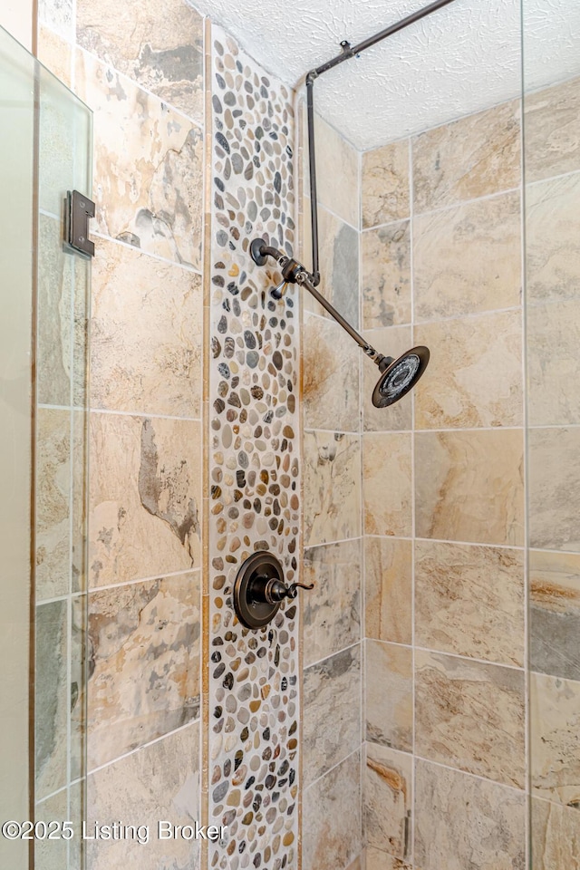 bathroom with a shower stall