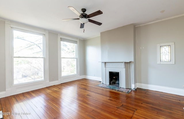 unfurnished living room with ornamental molding, hardwood / wood-style flooring, and ceiling fan