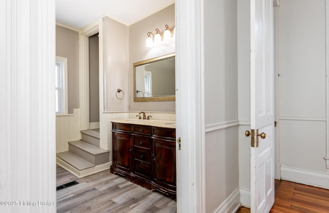 bathroom with vanity and hardwood / wood-style floors