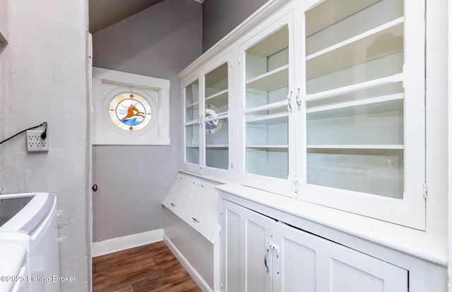 interior details with hardwood / wood-style flooring and washer and clothes dryer