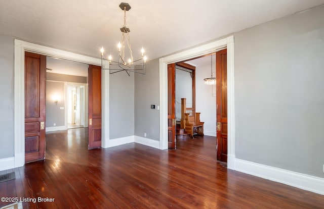 dining area with an inviting chandelier and dark hardwood / wood-style floors