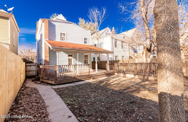 back of house with a wooden deck