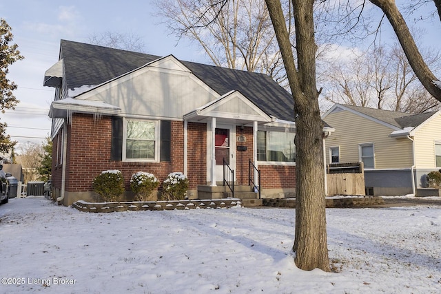 bungalow-style home with cooling unit