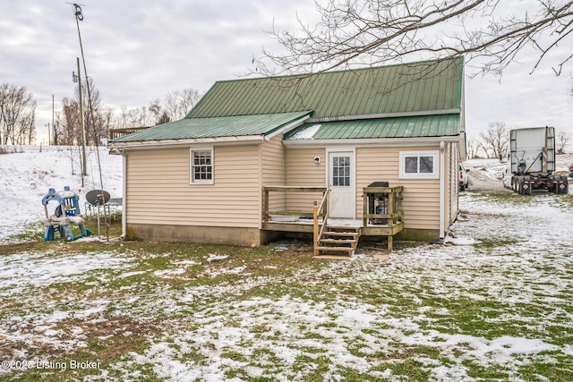 view of snow covered house