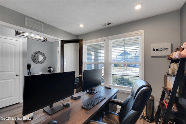 home office with wood-type flooring